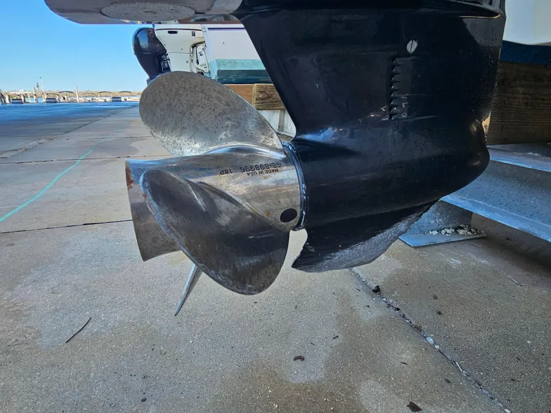 Slide: The Image of Close-up of a 2012 Boston Whaler 210 Montauk boat propeller on a concrete surface. - 3