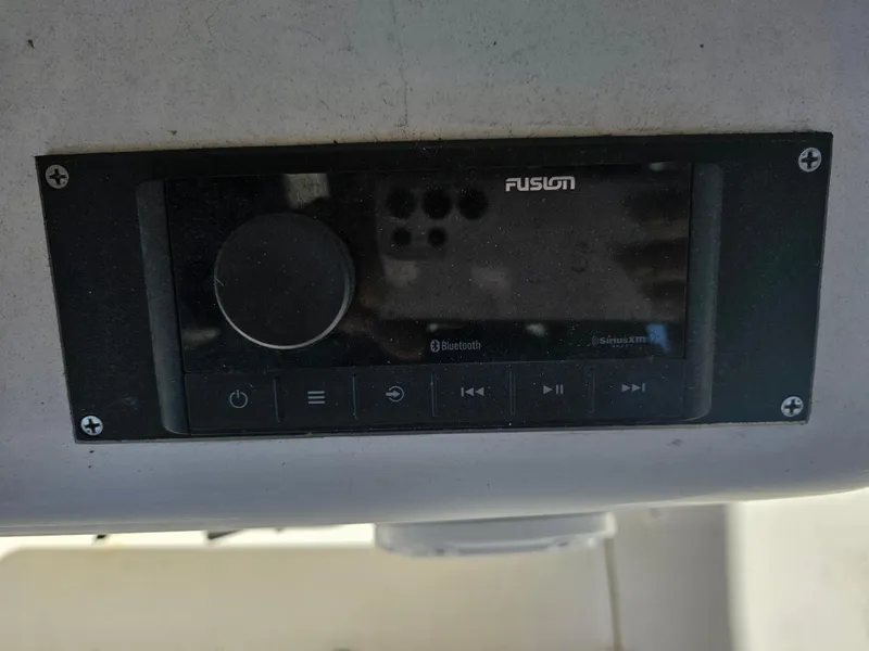 Slide: The Image of Fusion audio system on a 2012 Boston Whaler 210 Montauk boat dashboard. - 30