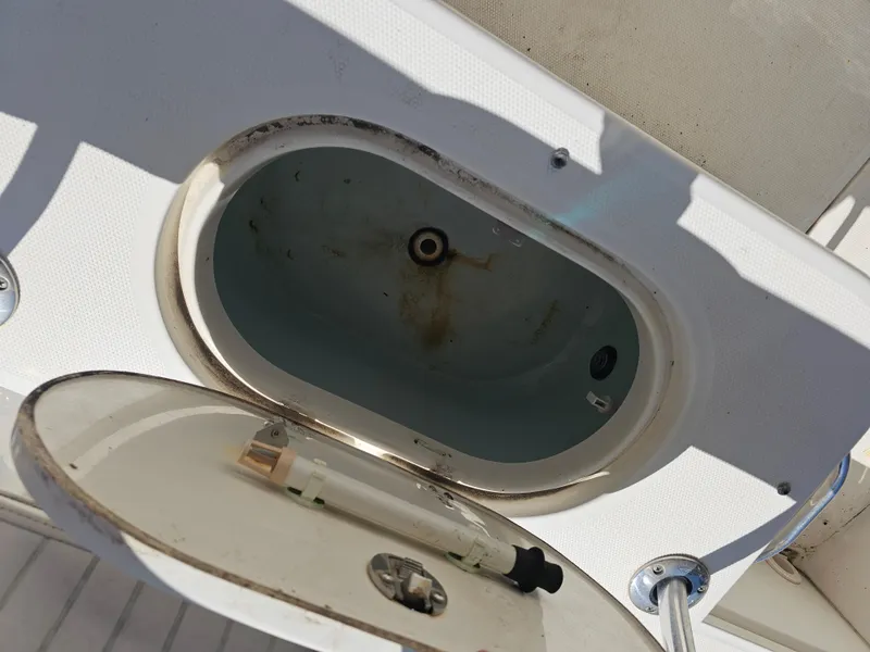 Slide: The Image of Open storage compartment on a 2012 Boston Whaler 210 Montauk boat. - 35