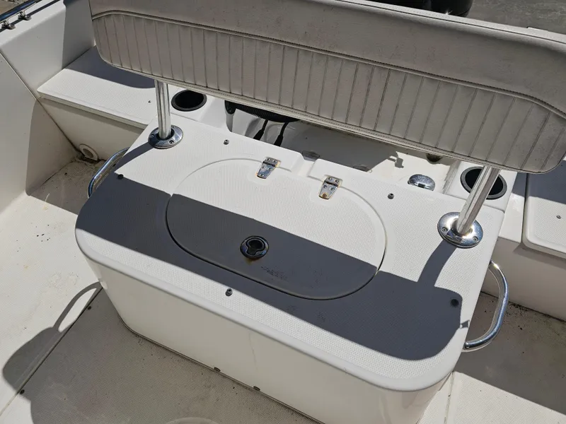 Slide: The Image of 2012 Boston Whaler 210 Montauk boat interior with seating and storage compartment. - 36