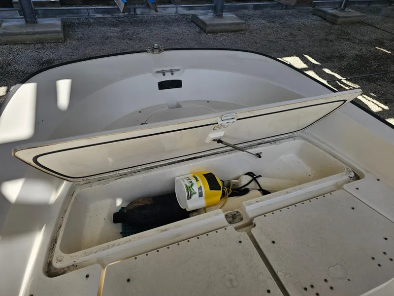 Slide: The Image of Open storage compartment on a 2012 Boston Whaler 210 Montauk boat. - 40