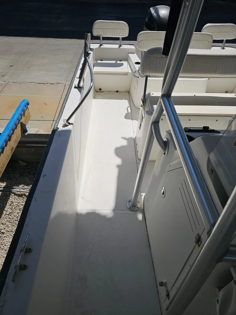 Slide: The Image of 2012 Boston Whaler 210 Montauk boat interior with seating and railing. - 45