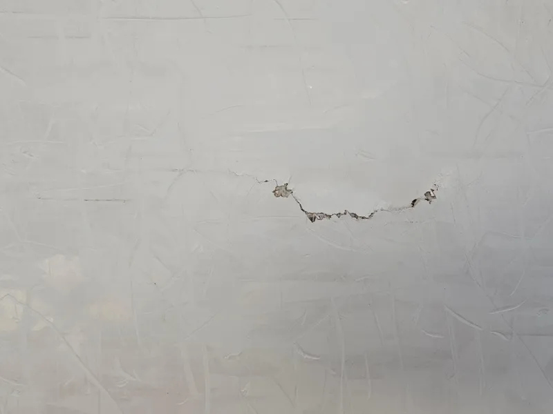 Slide: The Image of Cracked hull surface on a 2012 Boston Whaler 210 Montauk boat. - 8