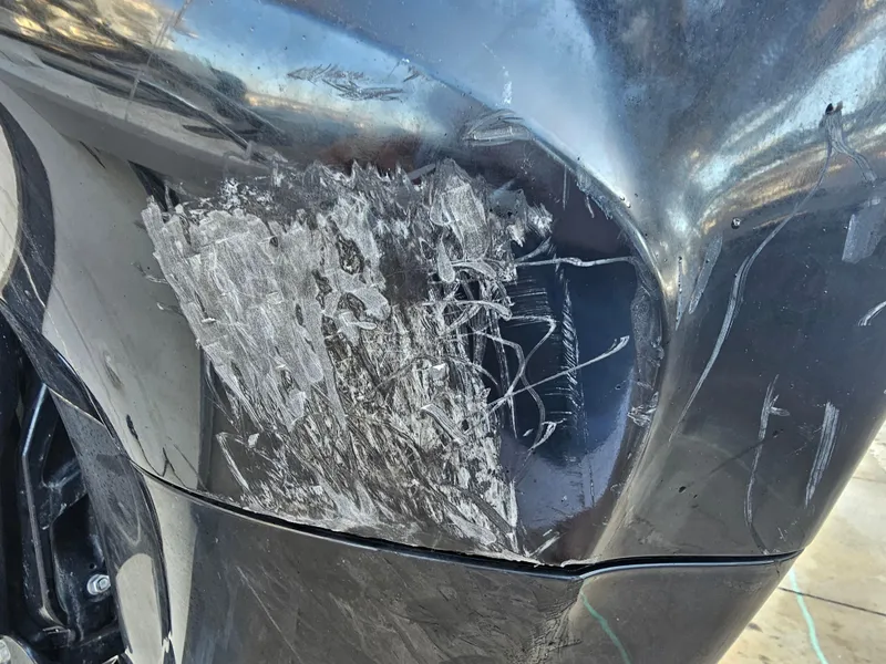 Slide: The Image of Scratched hull of a 2012 Boston Whaler 210 Montauk boat. - 9