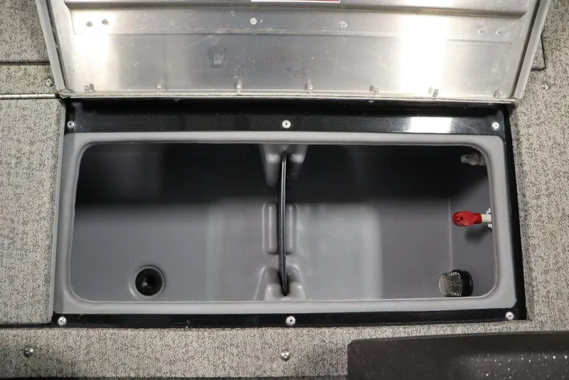 Slide: The Image of 2023 Tracker V16 Pro Guide WT storage compartment with open lid, showcasing interior space. - 19