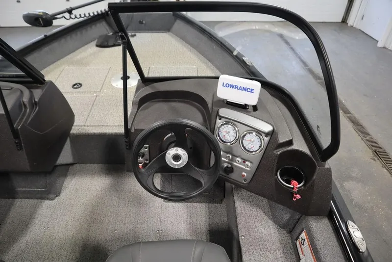 Slide: The Image of 2023 Tracker V16 Pro Guide WT boat dashboard with steering wheel and Lowrance navigation system. - 22
