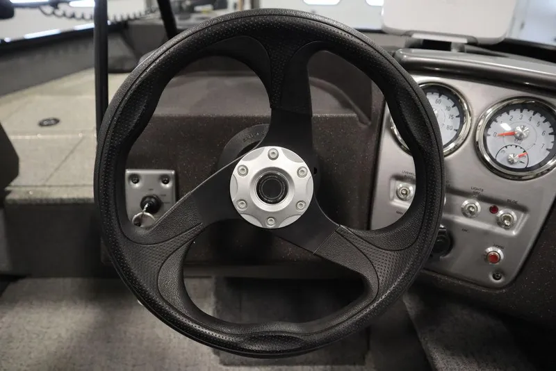 Slide: The Image of Steering wheel and dashboard of 2023 Tracker V16 Pro Guide WT boat. - 24