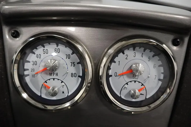 Slide: The Image of Dashboard gauges of 2023 Tracker V16 Pro Guide WT boat, showing speed and RPM. - 26