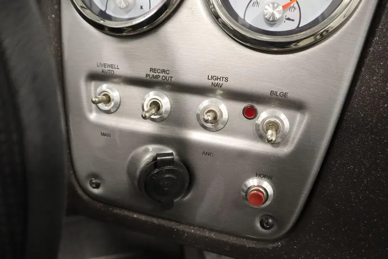 Slide: The Image of Control panel of 2023 Tracker V16 Pro Guide WT boat with switches and gauges. - 27