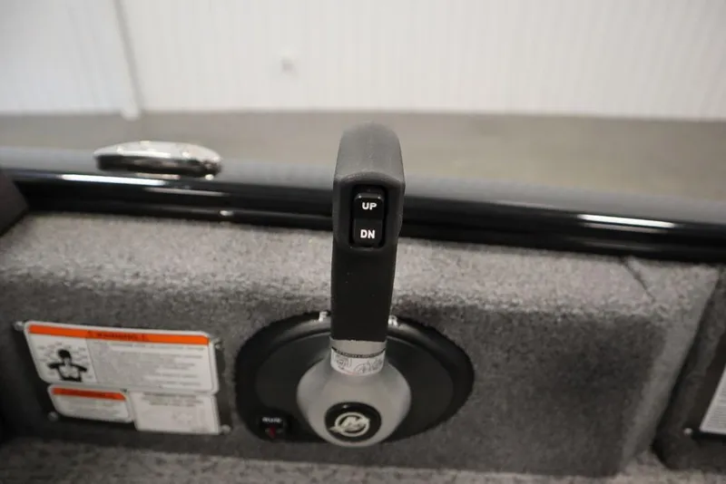 Slide: The Image of 2023 Tracker V16 Pro Guide WT boat control lever with "UP" and "DN" buttons. - 28