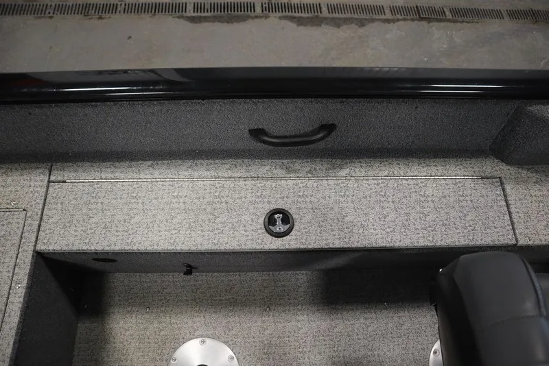 Slide: The Image of 2023 Tracker V16 Pro Guide WT boat interior with storage compartment and seating. - 35