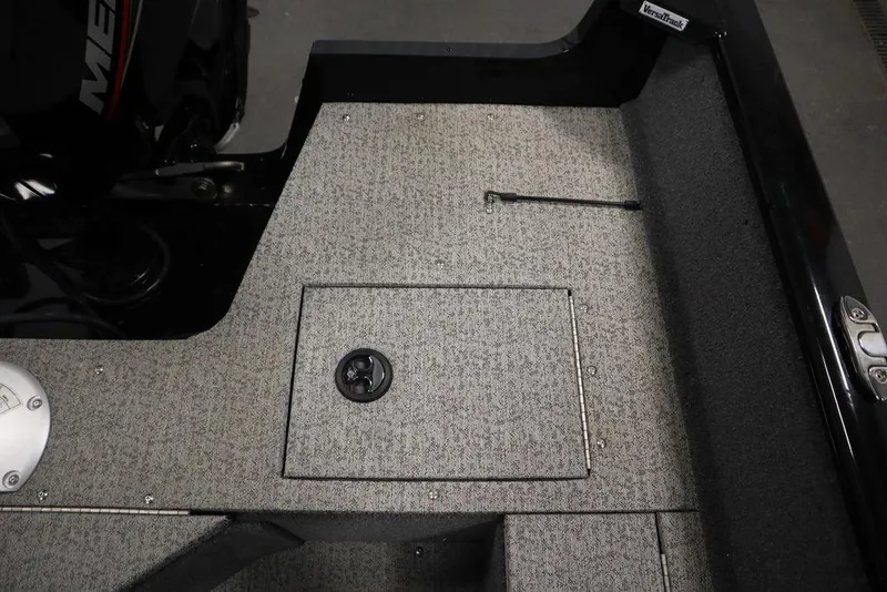 Slide: The Image of 2023 Tracker V16 Pro Guide WT boat interior with storage compartment and textured flooring. - 41