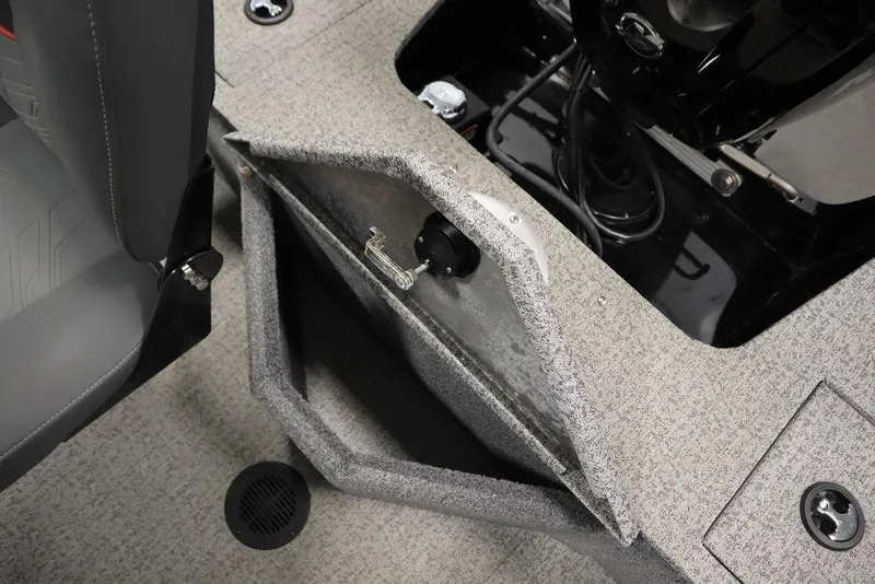 Slide: The Image of 2023 Tracker V16 Pro Guide WT boat interior with storage compartment open. - 45