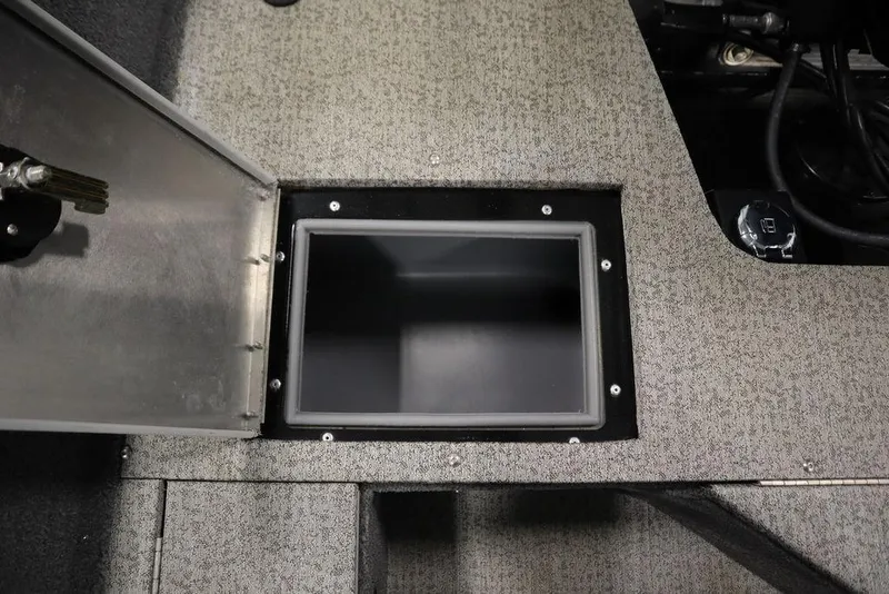 Slide: The Image of Open storage compartment in 2023 Tracker V16 Pro Guide WT boat. - 46
