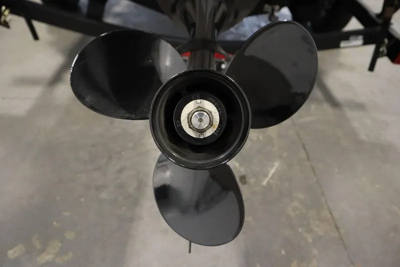 Slide: The Image of 2023 Tracker V16 Pro Guide WT boat propeller, close-up view on concrete floor. - 49