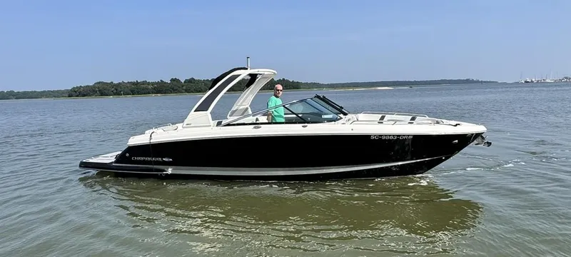 Slide: The Image of 2021 Chaparral 307 SSX boat cruising on calm waters. - 0