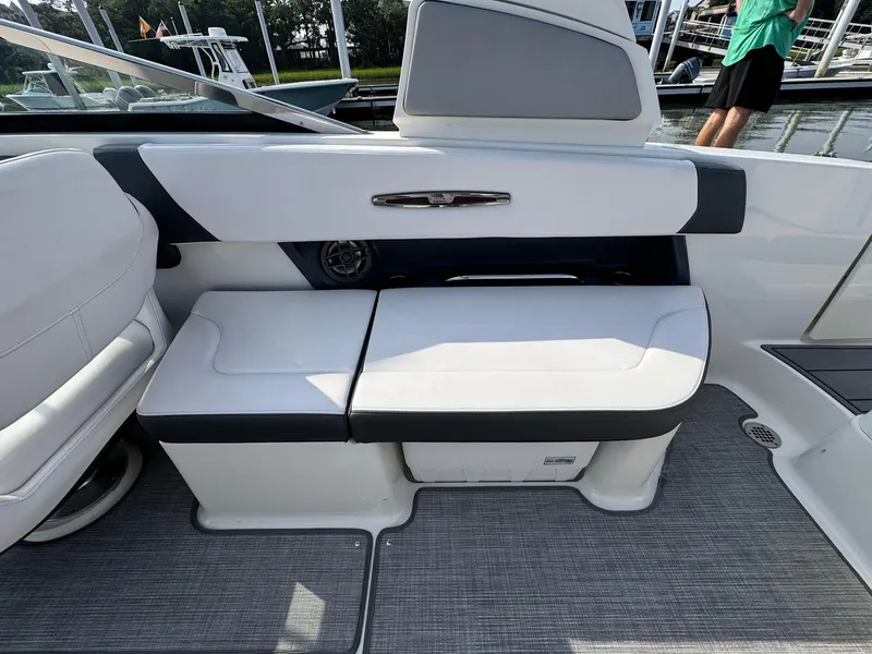 Slide: The Image of 2021 Chaparral 307 SSX boat interior with white seating and modern design. - 14
