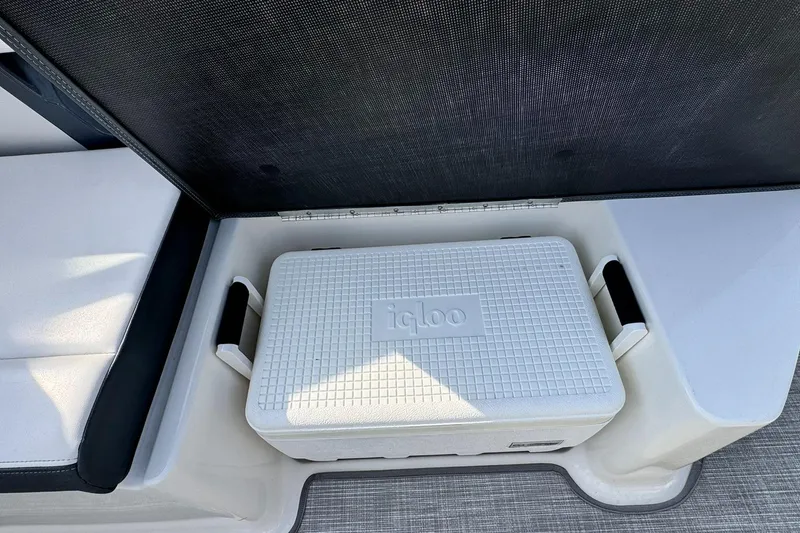 Slide: The Image of White Igloo cooler on Chaparral 307 SSX boat, 2021 model, with seating area. - 24