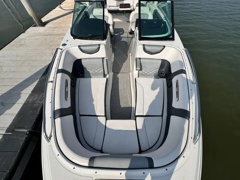 Slide: The Image of 2021 Chaparral 307 SSX boat interior with luxurious seating and sleek design. - 6
