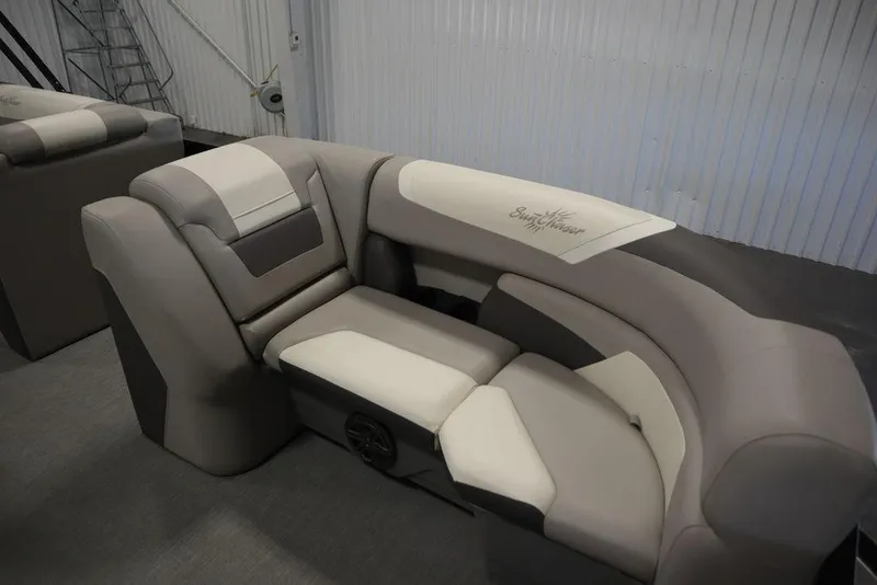 Slide: The Image of 2021 SunChaser 23 SBX Eclipse Tri-Toon boat seating in a showroom. - 12
