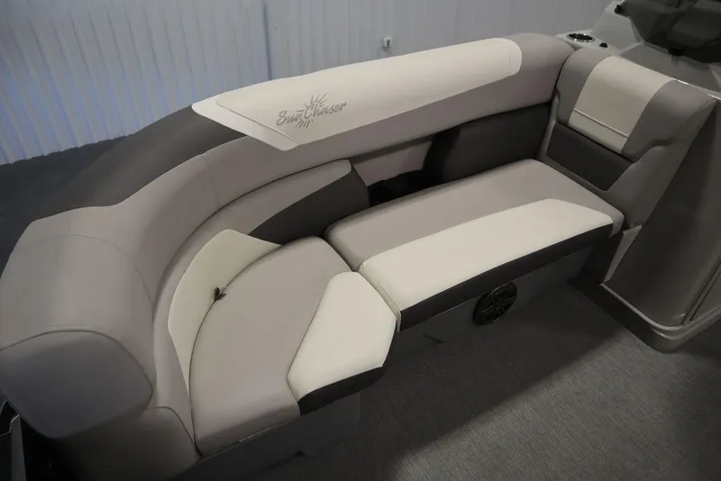 Slide: The Image of 2021 SunChaser 23 SBX Eclipse Tri-Toon boat interior with beige and gray seating. - 14
