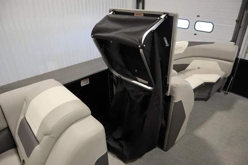 Slide: The Image of 2021 SunChaser 23 SBX Eclipse Tri-Toon interior with foldable privacy enclosure. - 18