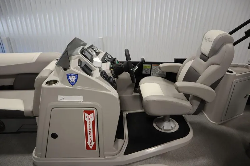 Slide: The Image of Captain's seat and console of 2021 SunChaser 23 SBX Eclipse Tri-Toon boat. - 19