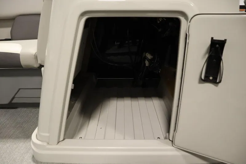 Slide: The Image of Storage compartment in 2021 SunChaser 23 SBX Eclipse Tri-Toon boat. - 20