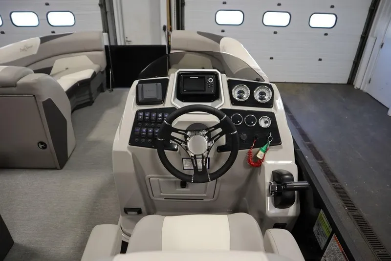 Slide: The Image of 2021 SunChaser 23 SBX Eclipse Tri-Toon boat dashboard with steering wheel and controls. - 21