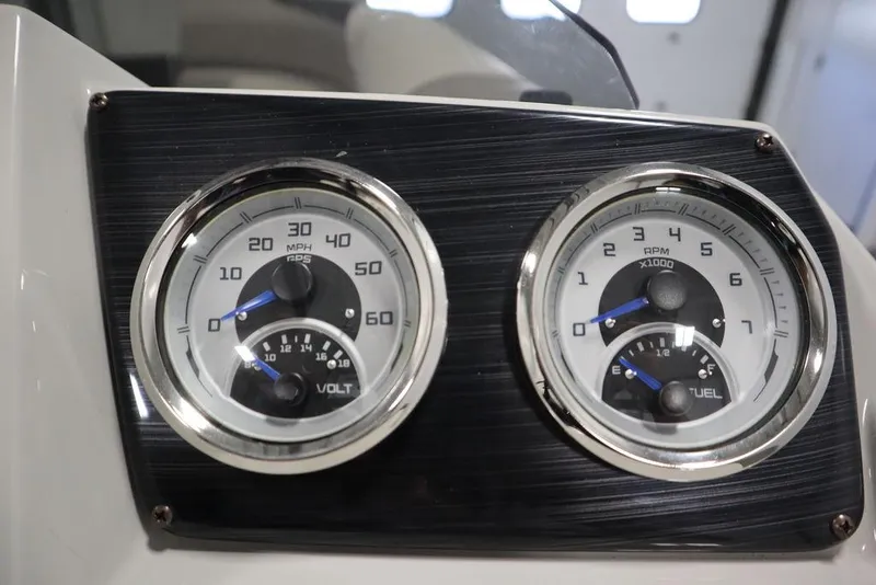 Slide: The Image of Dashboard gauges of 2021 SunChaser 23 SBX Eclipse Tri-Toon boat. - 27