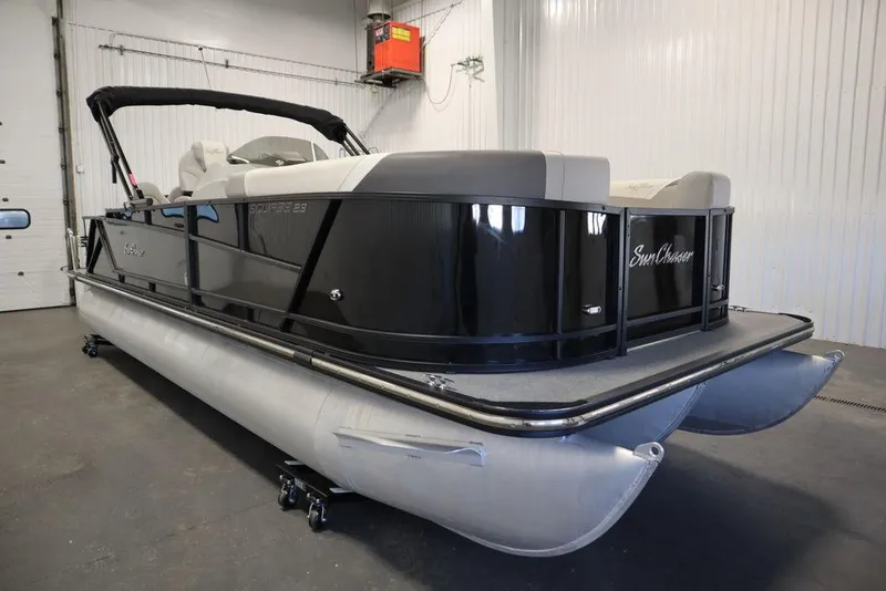 Slide: The Image of 2021 SunChaser 23 SBX Eclipse Tri-Toon boat in a showroom setting. - 3