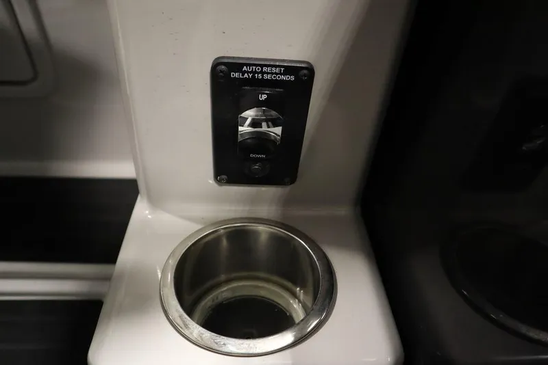Slide: The Image of Cup holder and control panel in 2021 SunChaser 23 SBX Eclipse Tri-Toon boat. - 32