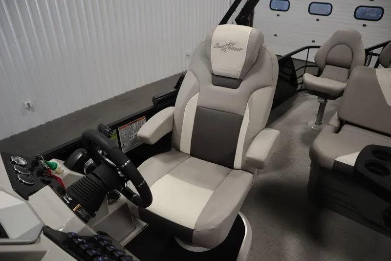 Slide: The Image of Captain's chair in 2021 SunChaser 23 SBX Eclipse Tri-Toon boat interior. - 34