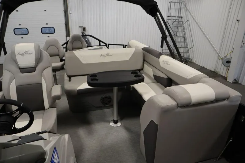 Slide: The Image of Interior of 2021 SunChaser 23 SBX Eclipse Tri-Toon with plush seating and table. - 35