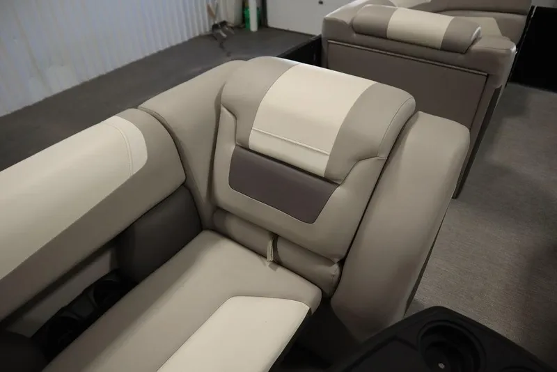 Slide: The Image of Luxurious seating in 2021 SunChaser 23 SBX Eclipse Tri-Toon boat, featuring beige and cream upholstery. - 36