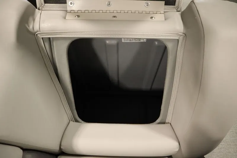 Slide: The Image of Storage compartment in 2021 SunChaser 23 SBX Eclipse Tri-Toon boat seat. - 37