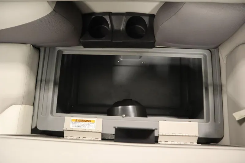 Slide: The Image of Storage compartment in 2021 SunChaser 23 SBX Eclipse Tri-Toon boat with cup holders. - 39