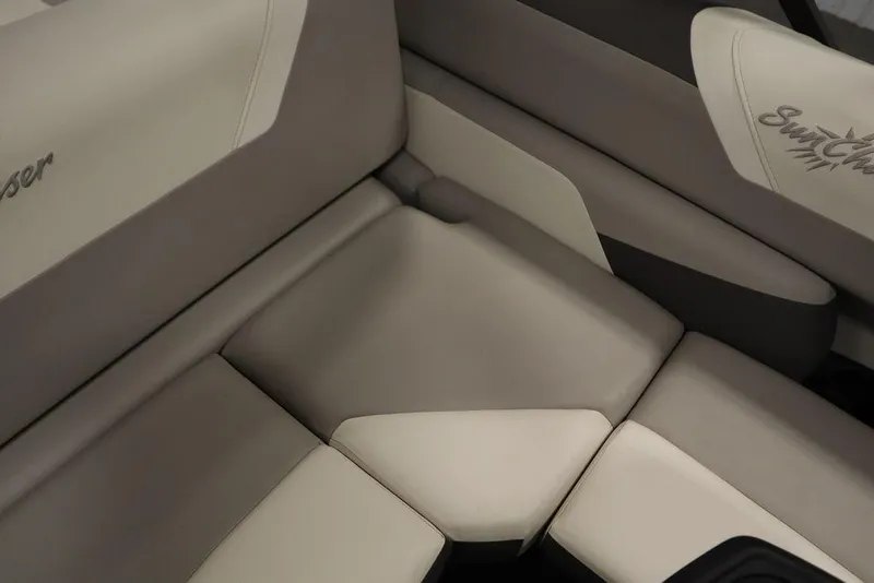 Slide: The Image of 2021 SunChaser 23 SBX Eclipse Tri-Toon boat interior seating, featuring beige and gray upholstery. - 40