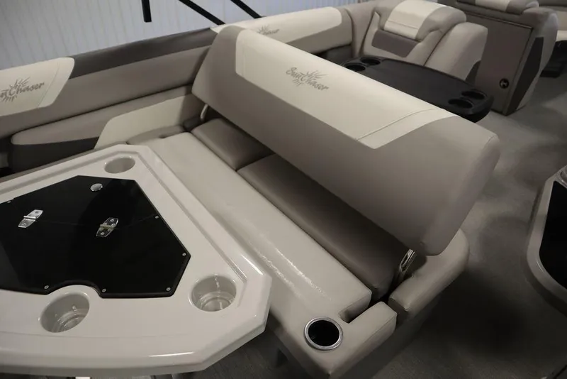 Slide: The Image of 2021 SunChaser 23 SBX Eclipse Tri-Toon interior with beige seating and table. - 43
