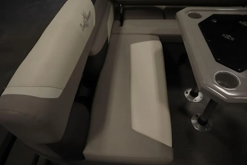 Slide: The Image of Interior seating of 2021 SunChaser 23 SBX Eclipse Tri-Toon boat with table and cup holders. - 49