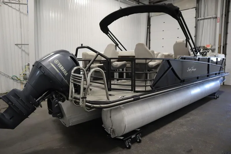 Slide: The Image of 2021 SunChaser 23 SBX Eclipse Tri-Toon boat with Yamaha outboard motor in a garage. - 5