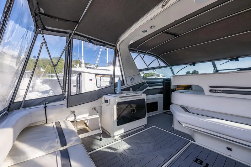 Slide: The Image of Interior of 1991 Sea Ray 420 Sundancer yacht with spacious seating and modern design. - 13