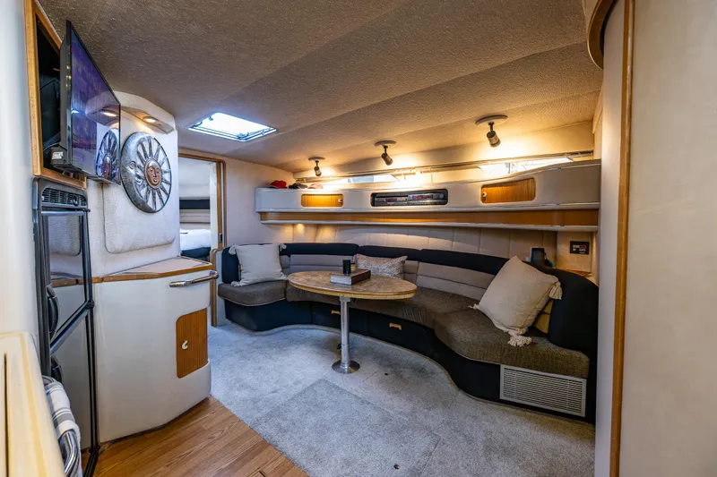 Slide: The Image of Interior of 1991 Sea Ray 420 Sundancer yacht with cozy seating and modern amenities. - 20
