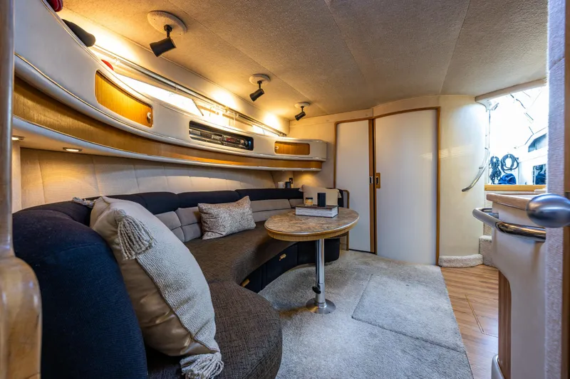Slide: The Image of Luxurious interior of 1991 Sea Ray 420 Sundancer yacht with cozy seating and elegant decor. - 22