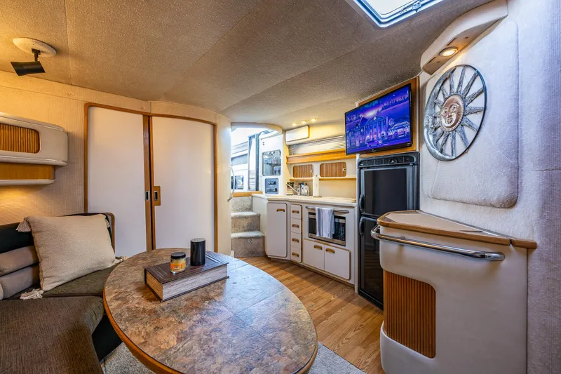 Slide: The Image of Luxurious interior of a 1991 Sea Ray 420 Sundancer yacht with modern amenities. - 23