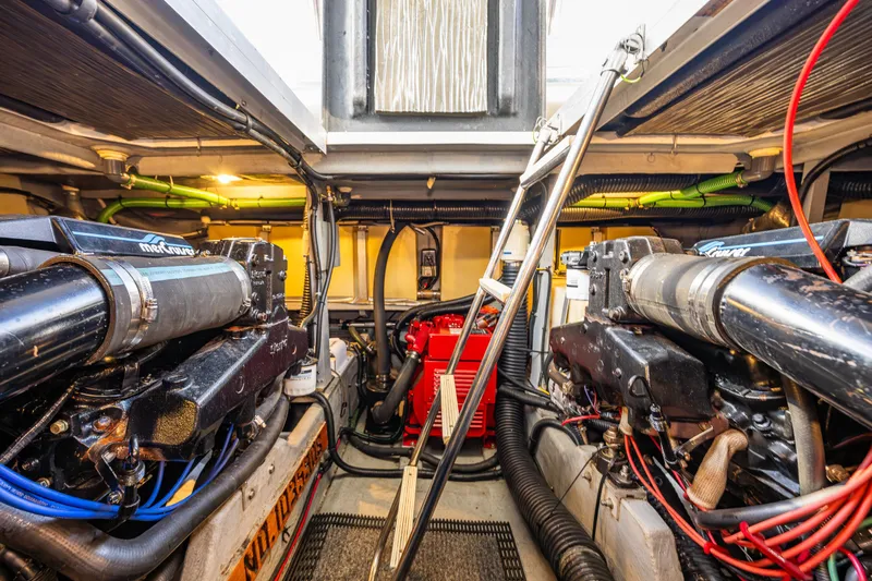 Slide: The Image of Engine room of 1991 Sea Ray 420 Sundancer with twin engines and ladder access. - 40