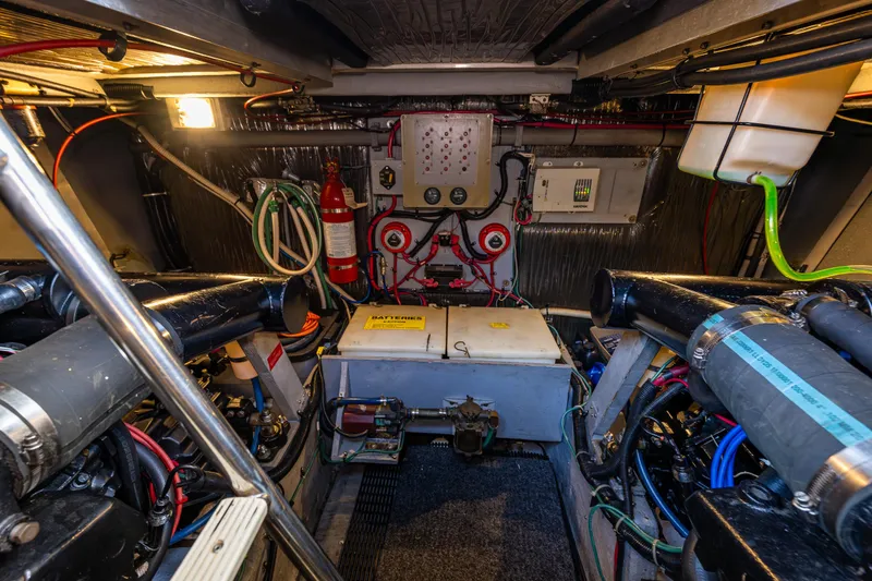 Slide: The Image of Engine room of a 1991 Sea Ray 420 Sundancer, showcasing mechanical components and wiring. - 41