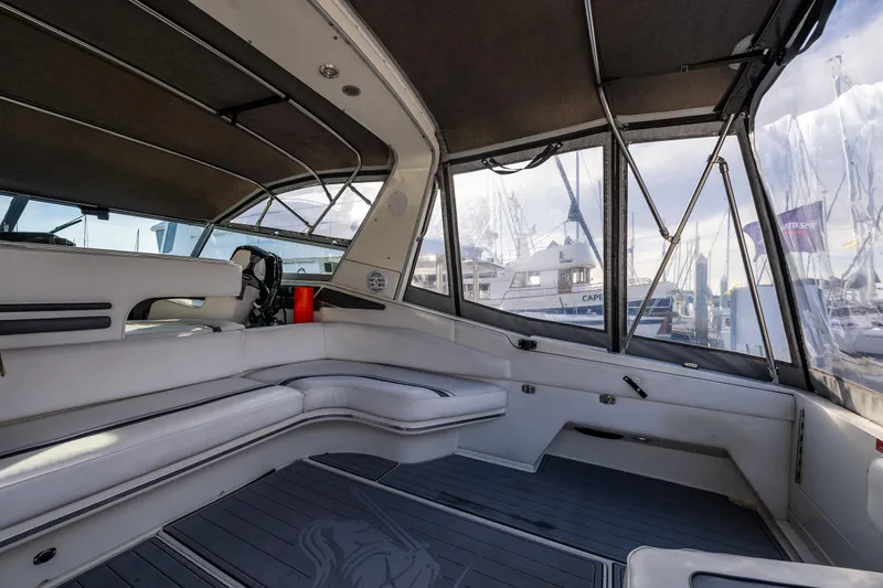 Slide: The Image of Interior view of 1991 Sea Ray 420 Sundancer yacht with seating and helm. - 9