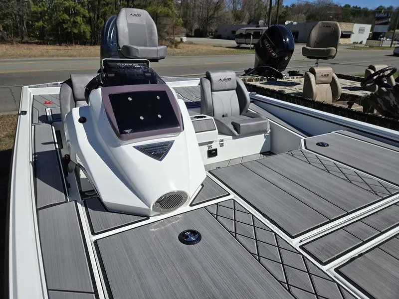 Slide: The Image of 2025 Avid 20 Vertex boat with sleek design and modern seating on display. - 12