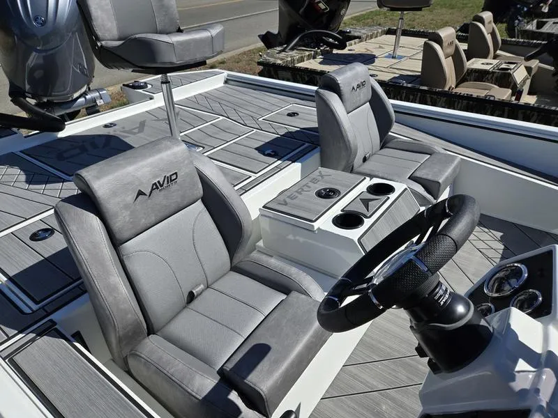 Slide: The Image of 2025 Avid 20 Vertex boat interior with gray seating and steering wheel. - 13